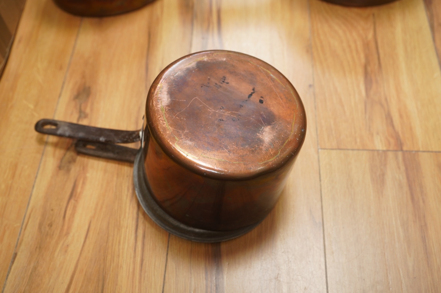 Two Benham & Froud copper saucepans and a copper kettle, largest 43cm in length